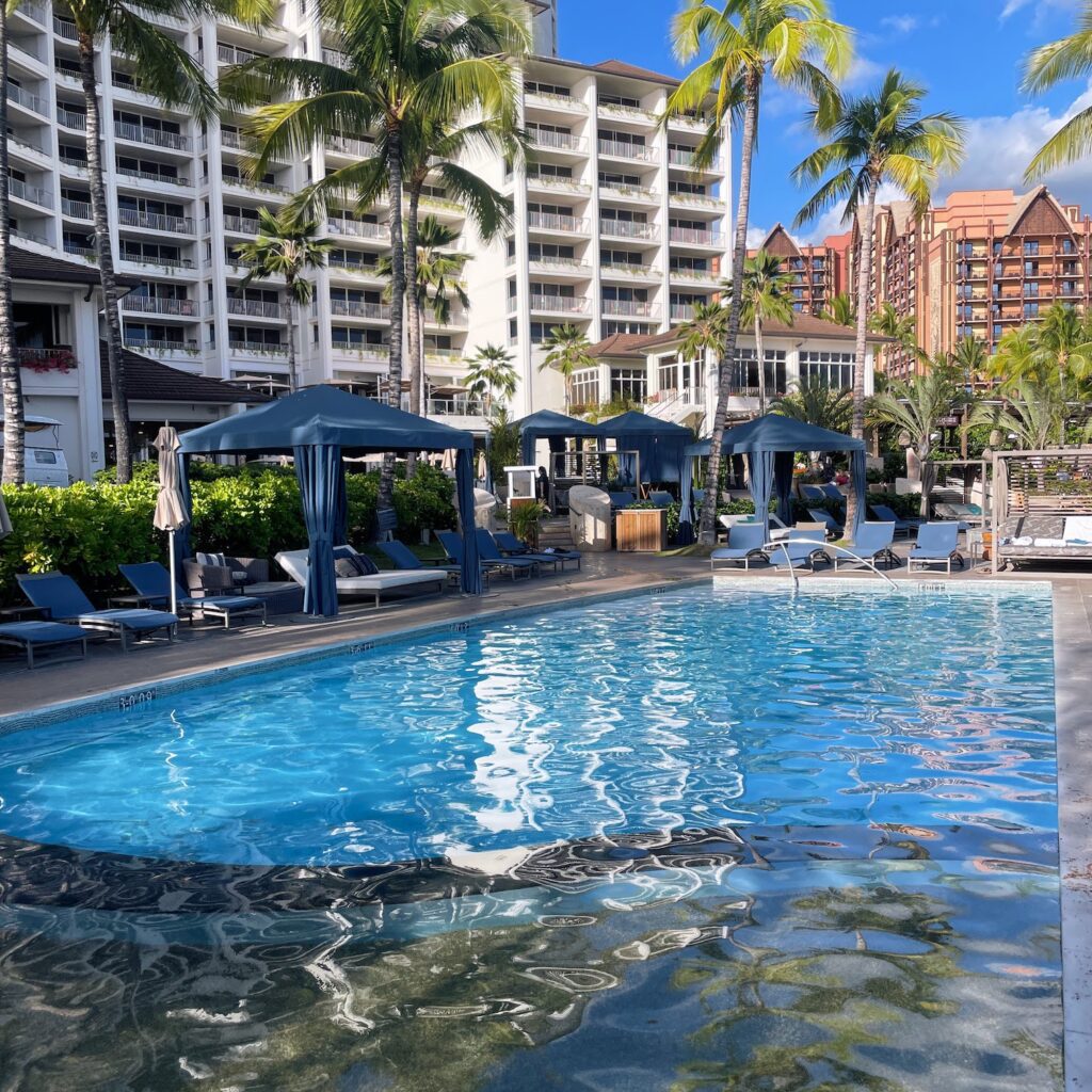 Review & Video: Four Seasons Oahu at Ko Olina, Pinnacle of Luxury Hawaii Calling a pool with lounge chairs and umbrellas in front of a building