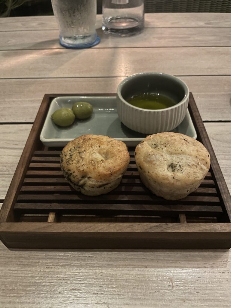 Review & Video: Four Seasons Oahu at Ko Olina, Pinnacle of Luxury Hawaii Calling food on a tray with a bowl of oil and olives