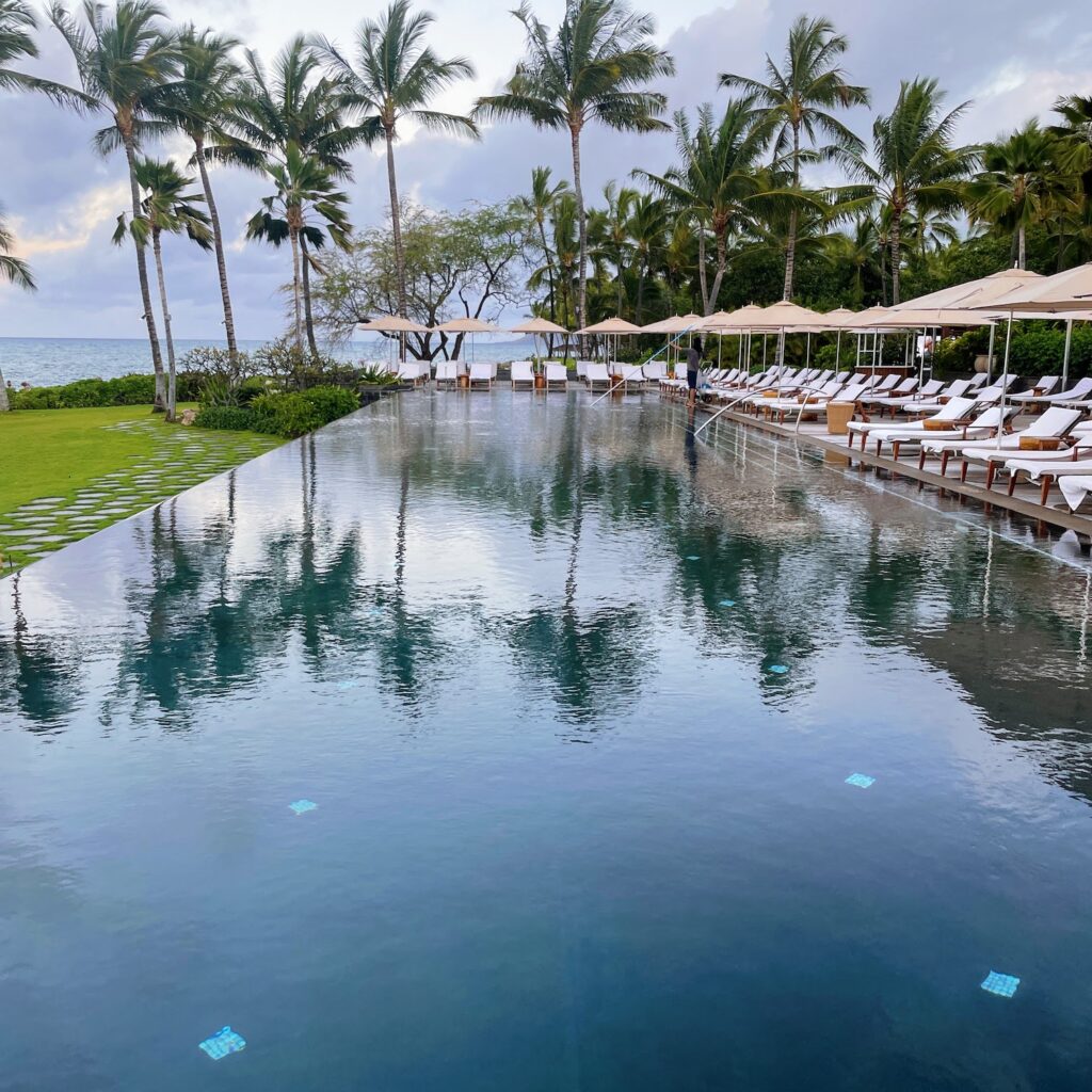 Review & Video: Four Seasons Oahu at Ko Olina, Pinnacle of Luxury Hawaii Calling a pool with lounge chairs and umbrellas by the ocean