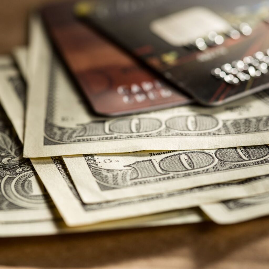 10 Essential Things to Pack For Your Trip To Hawai'i Hawaii Calling a close up of a credit card and money