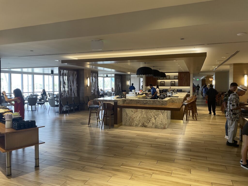 100 Sails Sunday Brunch | Prince Waikiki | A Favorite Hawaii Calling a large room with a large counter and people in it