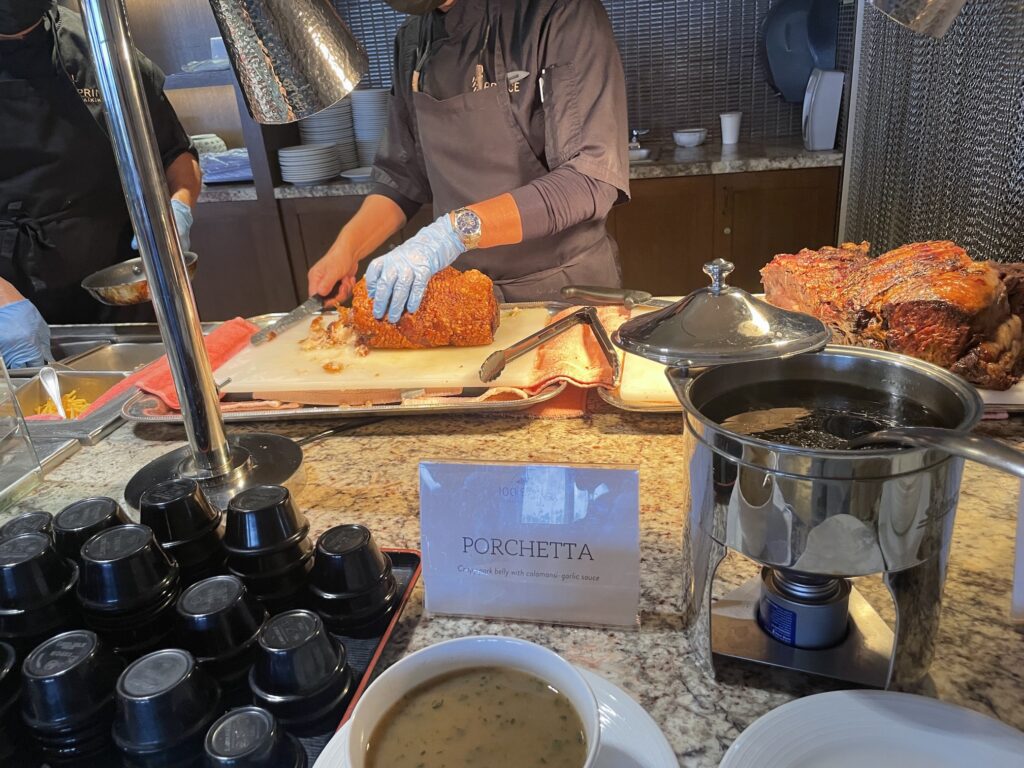 100 Sails Sunday Brunch | Prince Waikiki | A Favorite Hawaii Calling a person cutting meat in a kitchen
