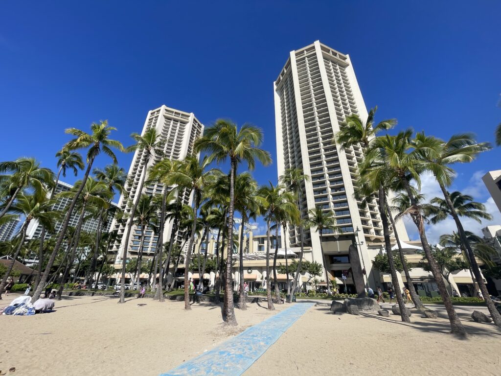 The 15 Best Hotels On Oahu For Families 2025 Hawaii Calling a tall buildings with palm trees