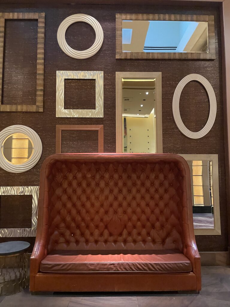 Delano Las Vegas Clean Air Oasis | Review & Video Hawaii Calling a brown leather couch in front of a wall with mirrors