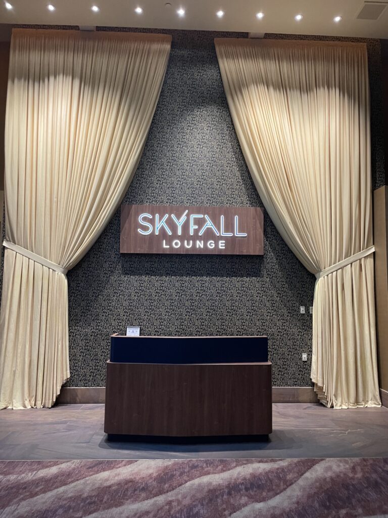 Delano Las Vegas Clean Air Oasis | Review & Video Hawaii Calling a reception desk with a sign and a sign on the wall