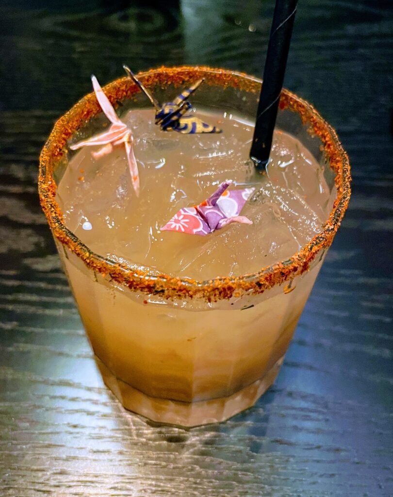 Classy Cool STRIPSTEAK Las Vegas | Review & Video Hawaii Calling a drink with a straw and a paper crane