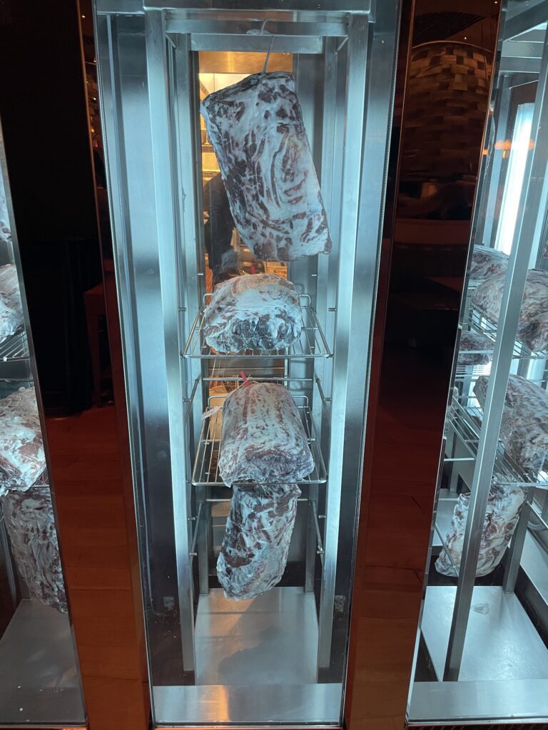 Classy Cool STRIPSTEAK Las Vegas | Review & Video Hawaii Calling meat on racks in a room