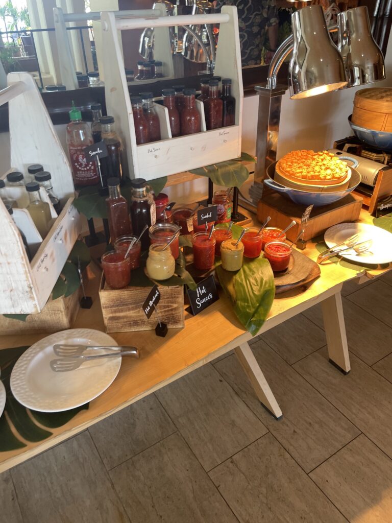 Delightful La Hiki Sunday Brunch | Four Seasons Oahu Hawaii Calling a table with different sauces and bowls of food