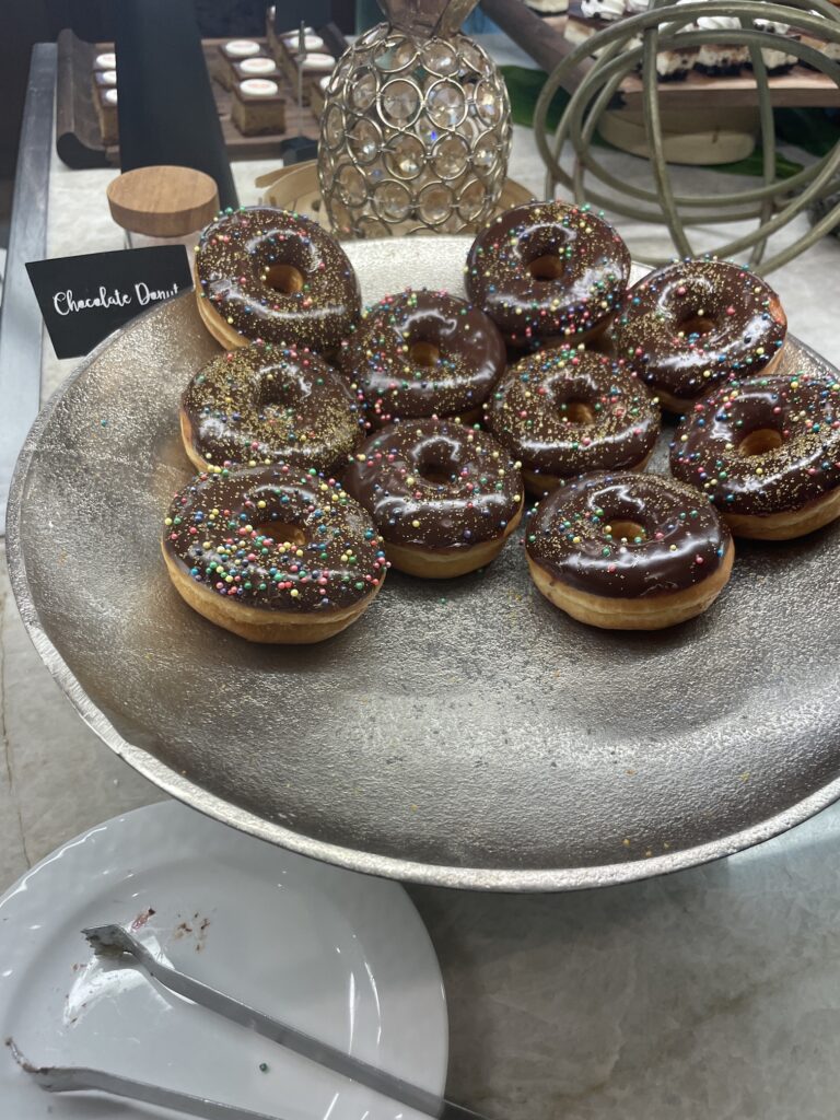 Delightful La Hiki Sunday Brunch | Four Seasons Oahu Hawaii Calling a plate of chocolate donuts