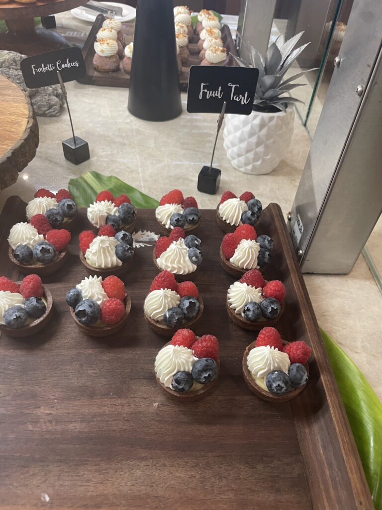 Delightful La Hiki Sunday Brunch | Four Seasons Oahu Hawaii Calling a tray of fruit tarts