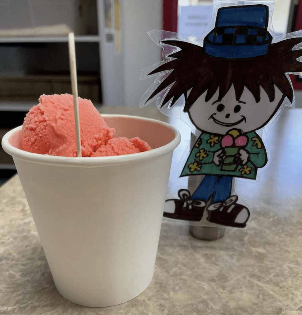 7 Best Ice Cream Shops In Maui | Island Guide Hawaii Calling a cup of pink ice cream with a stick and a cartoon figure