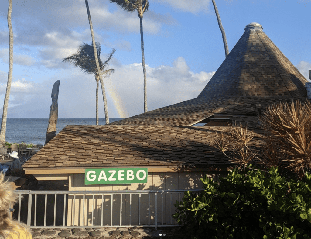 10 Best Maui Restaurants | Dining Guide for (2025) Hawaii Calling a building with a triangular roof and a sign on it