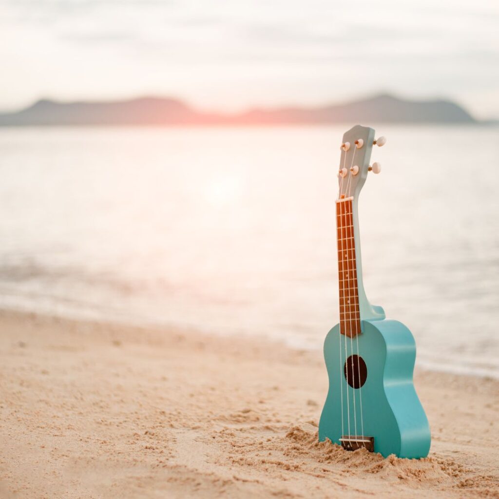 The 10 Best Music Festivals In Hawaii Hawaii Calling a blue ukulele on a beach