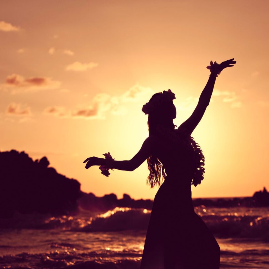 The 10 Best Music Festivals In Hawaii Hawaii Calling a silhouette of a woman dancing on a beach