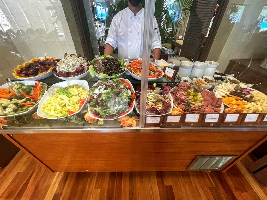 11 Best Sunday Brunch Buffets On Oahu Hawaii Calling a man standing behind a counter with food on it