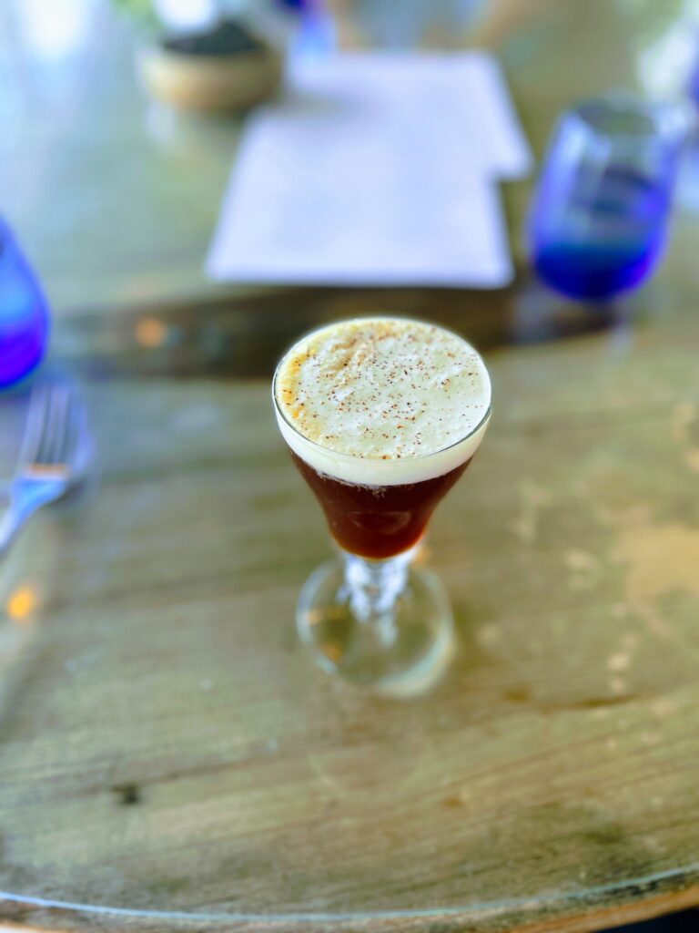 Relaxed Oceanside Hau Tree Brunch Review Hawaii Calling a glass with a drink on a table