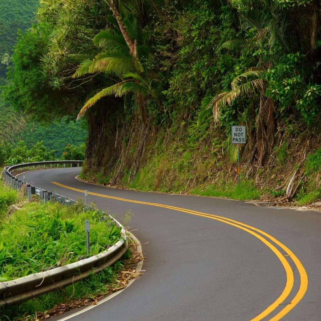 Best Places To Stay In Hawaii (2025)| A Hotel & Island Guide Hawaii Calling a road with a sign on the side