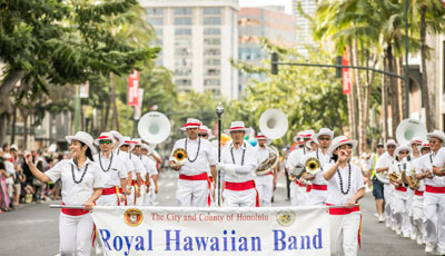The 10 Best Music Festivals In Hawaii Hawaii Calling a group of people in white outfits marching in a parade