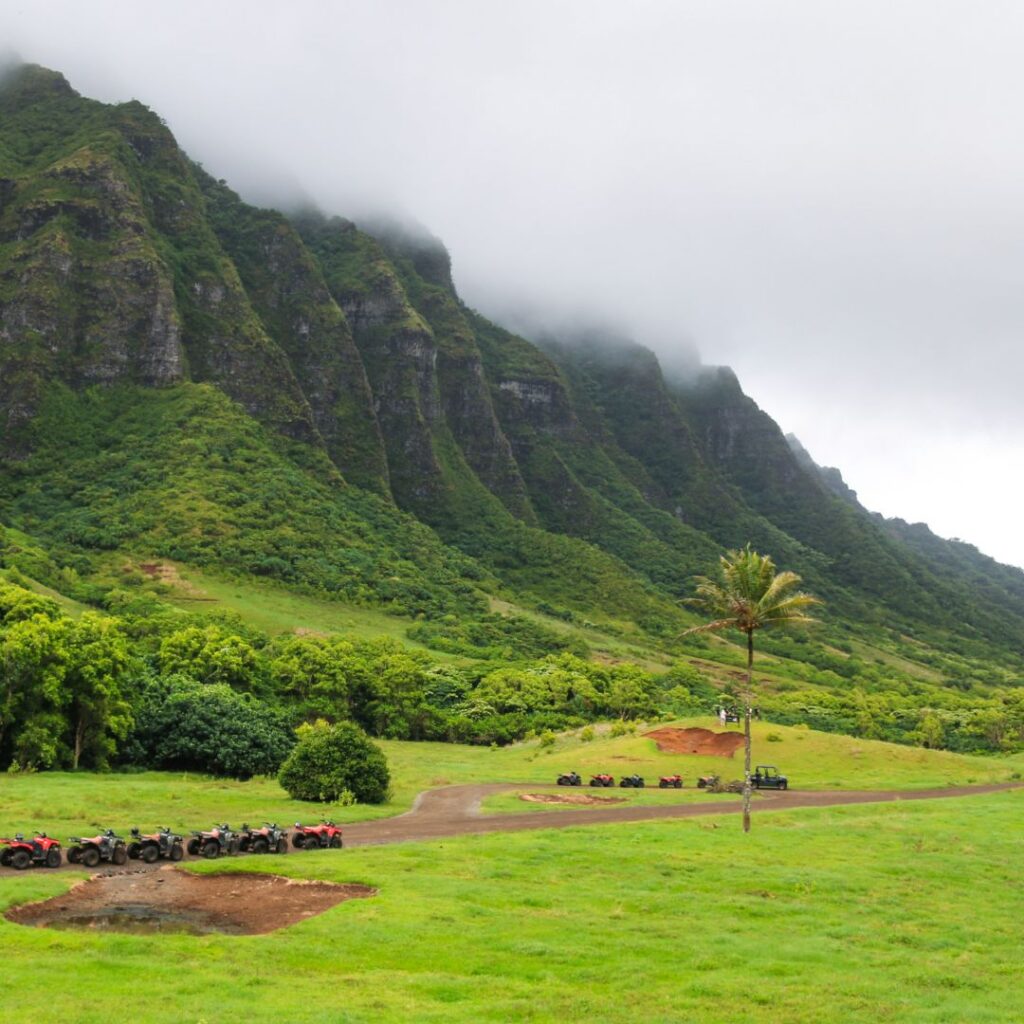 The 41 Best Things To Do On Oahu | Bucket List Guide (2025) Hawaii Calling a group of atvs parked in a field with a mountain in the background