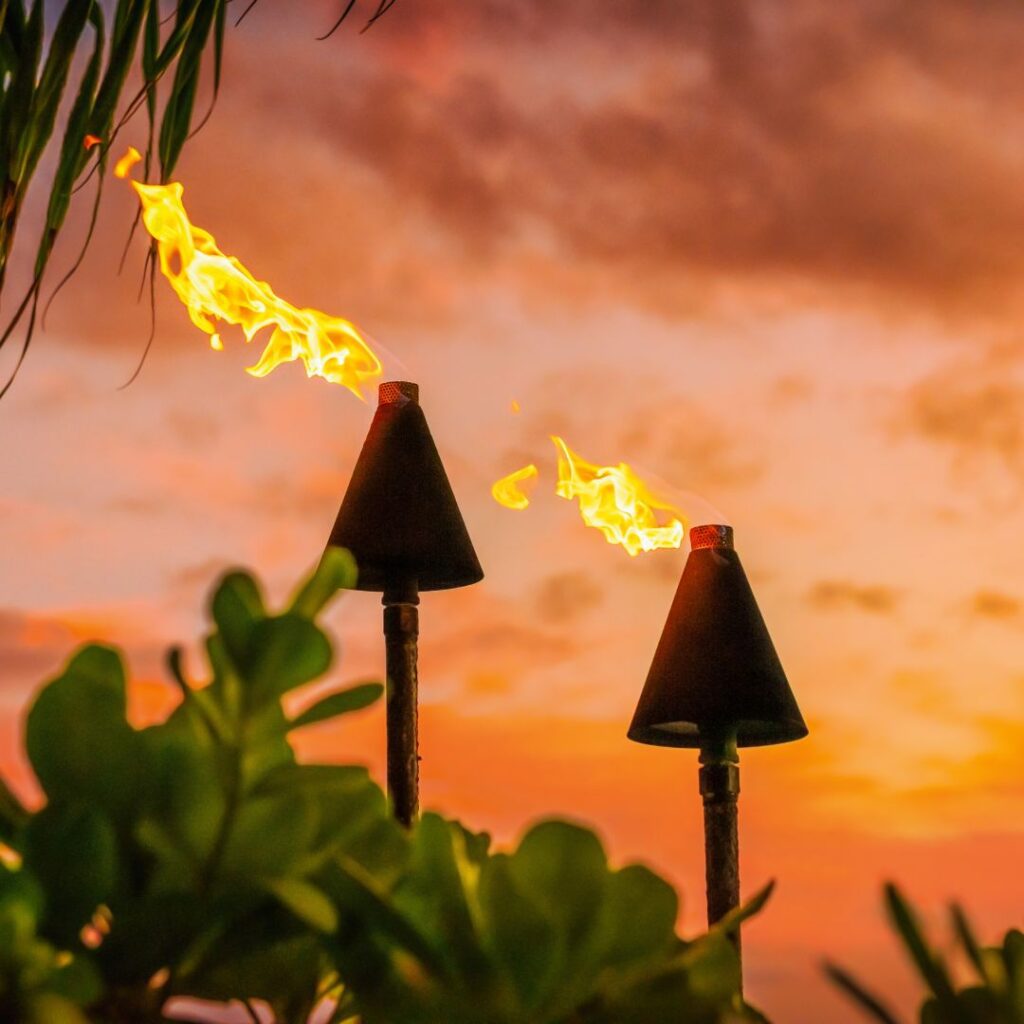 The 30 Best Things To Do On Kauai | A Bucket List Guide (2025) Hawaii Calling a tiki torches with fire coming out of them