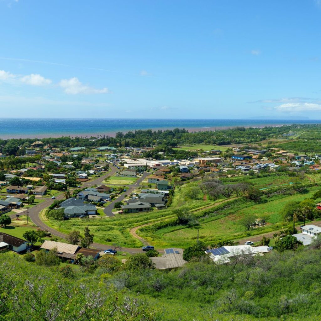The 30 Best Things To Do On Kauai | A Bucket List Guide (2025) Hawaii Calling a landscape with a town and a body of water