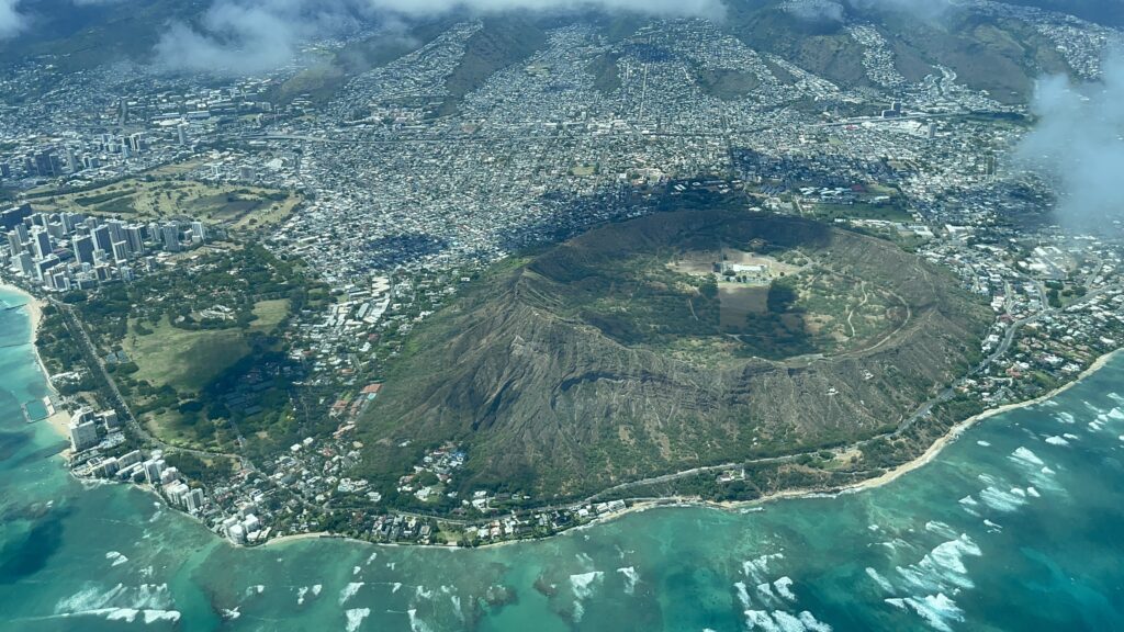 Mokulele Flight Review Honolulu To Kapalua | Exciting Small Plane Adventure Hawaii Calling aerial view of a city and a volcano