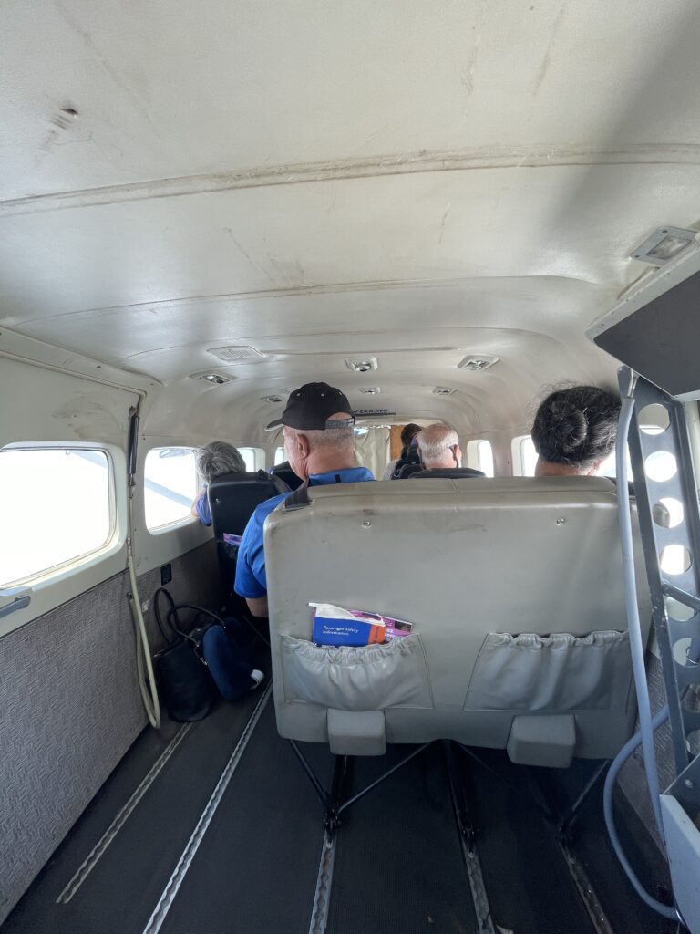Mokulele Flight Review Honolulu To Kapalua | Exciting Small Plane Adventure Hawaii Calling a group of people sitting in a plane