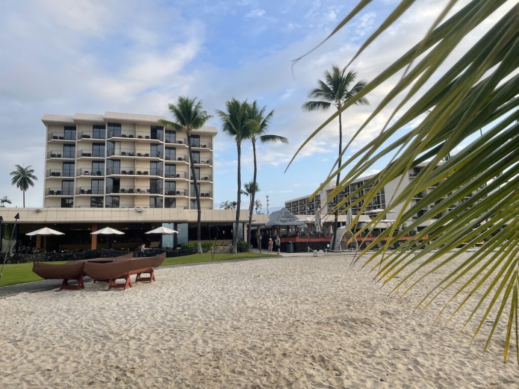 7 Best Family Hotels On The Big Island Hawaii Calling a beach with palm trees and boats