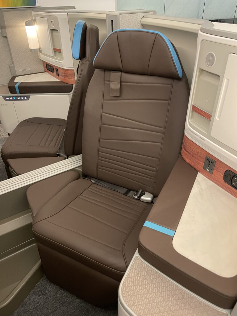 A Sneak Peek Of Hawaiian Airlines Boeing 787 Dreamliner Business Class Seats Hawaii Calling a brown and blue seats in a plane