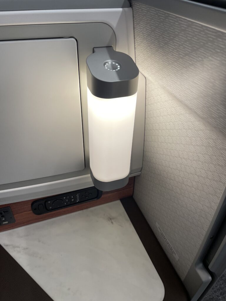 A Sneak Peek Of Hawaiian Airlines Boeing 787 Dreamliner Business Class Seats Hawaii Calling a light on a wall