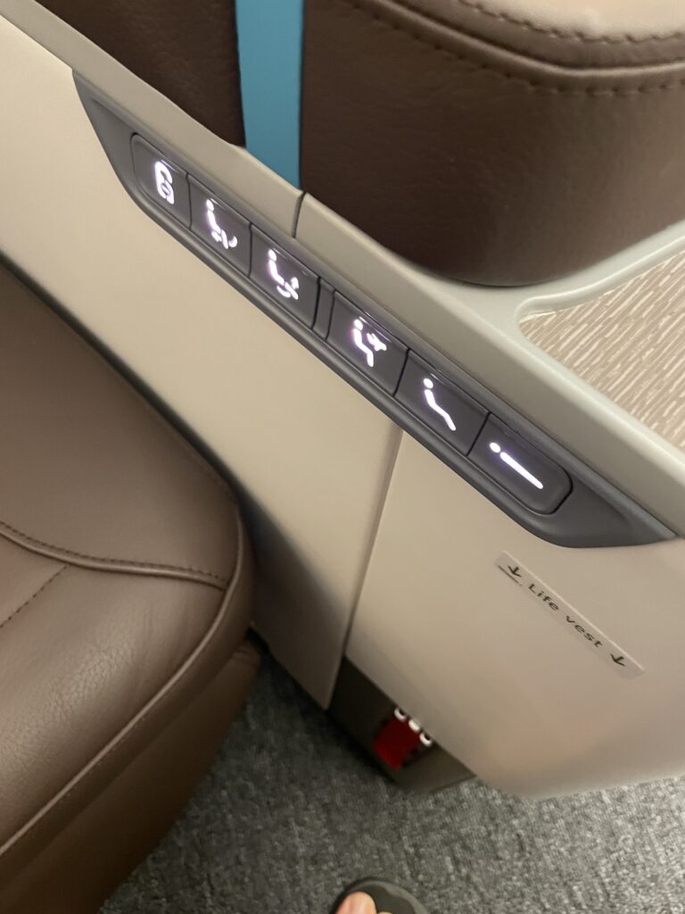 A Sneak Peek Of Hawaiian Airlines Boeing 787 Dreamliner Business Class Seats Hawaii Calling a seat with buttons and lights on the side
