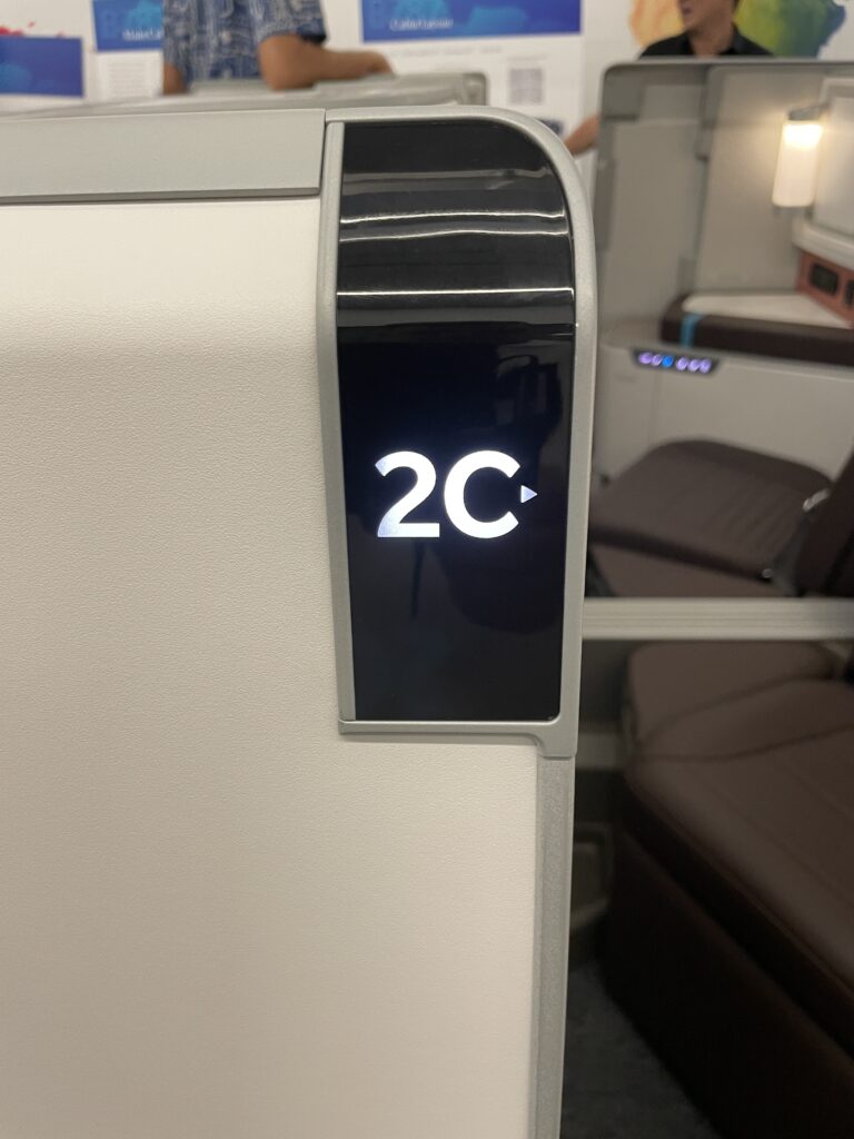 A Sneak Peek Of Hawaiian Airlines Boeing 787 Dreamliner Business Class Seats Hawaii Calling a close up of a sign