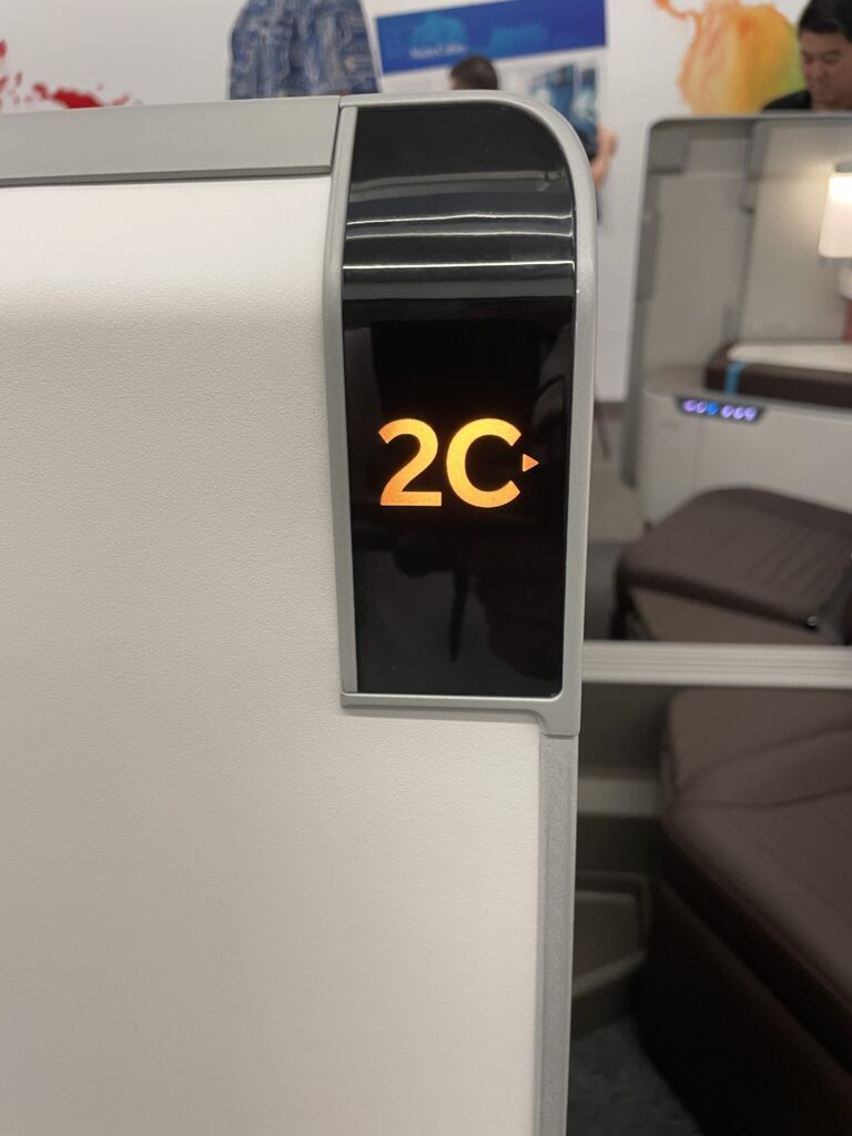 A Sneak Peek Of Hawaiian Airlines Boeing 787 Dreamliner Business Class Seats Hawaii Calling a close up of a sign