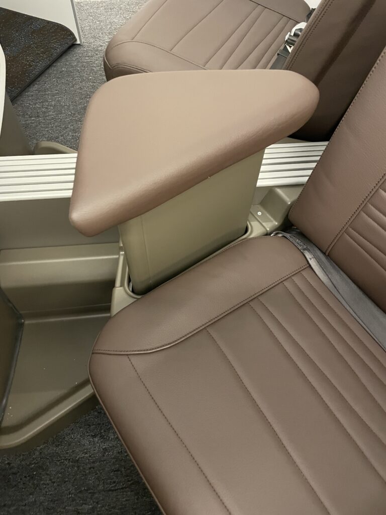 A Sneak Peek Of Hawaiian Airlines Boeing 787 Dreamliner Business Class Seats Hawaii Calling arm rest of a car