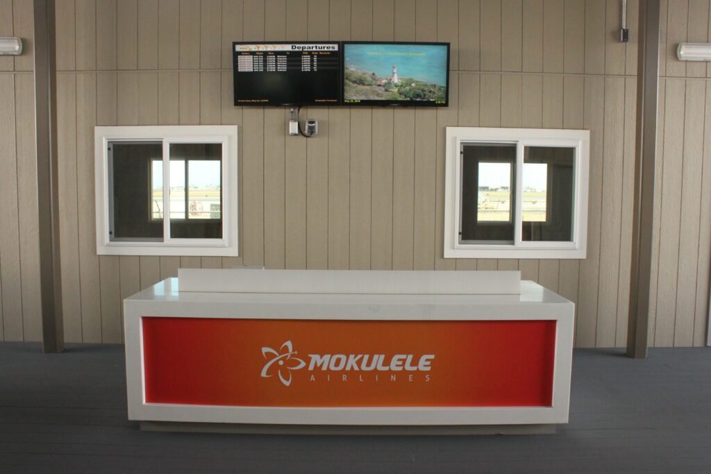 Mokulele Flight Review Honolulu To Kapalua | Exciting Small Plane Adventure Hawaii Calling a counter in a room with windows and a television