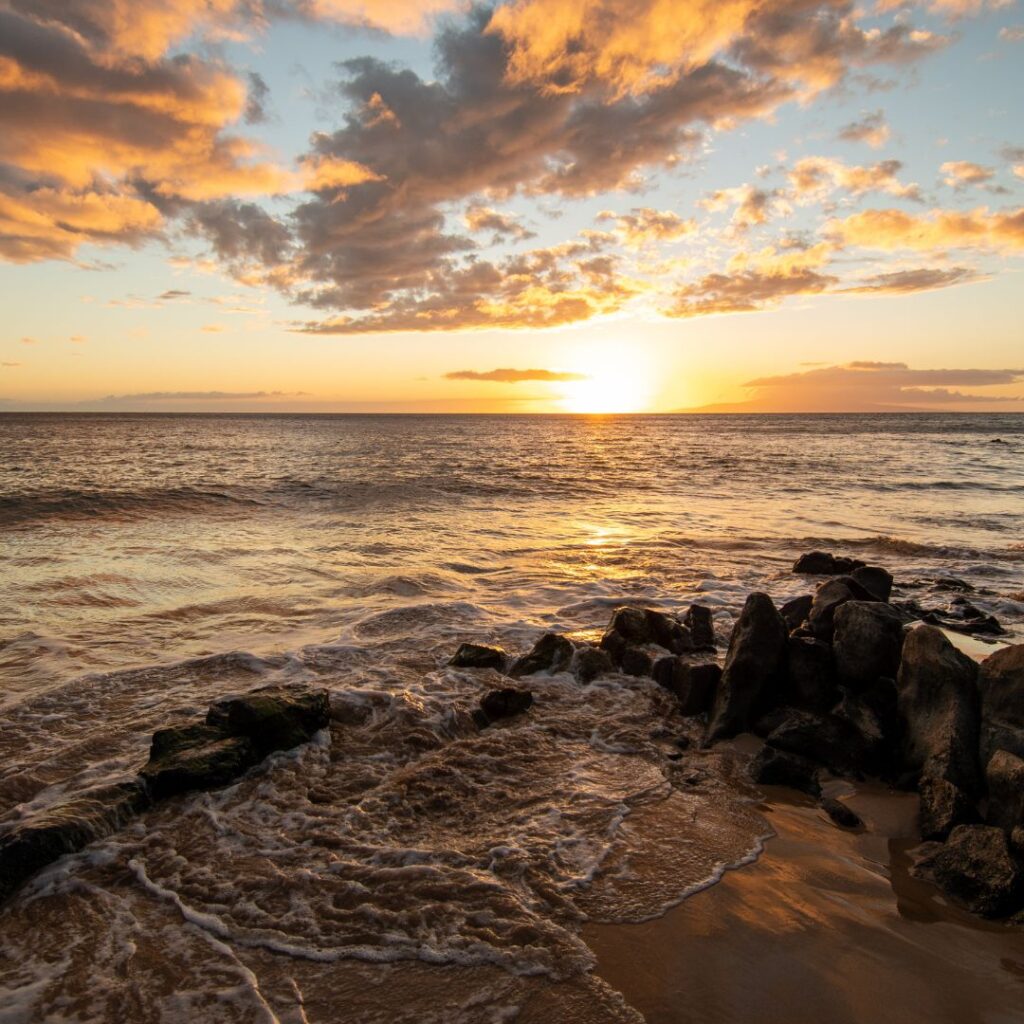 Snorkeling on Maui: The Ultimate Guide To 27 Amazing Spots Hawaii Calling a sunset over a beach