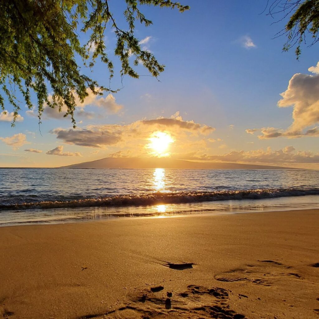 Snorkeling on Maui: The Ultimate Guide To 27 Amazing Spots Hawaii Calling a sunset over a beach