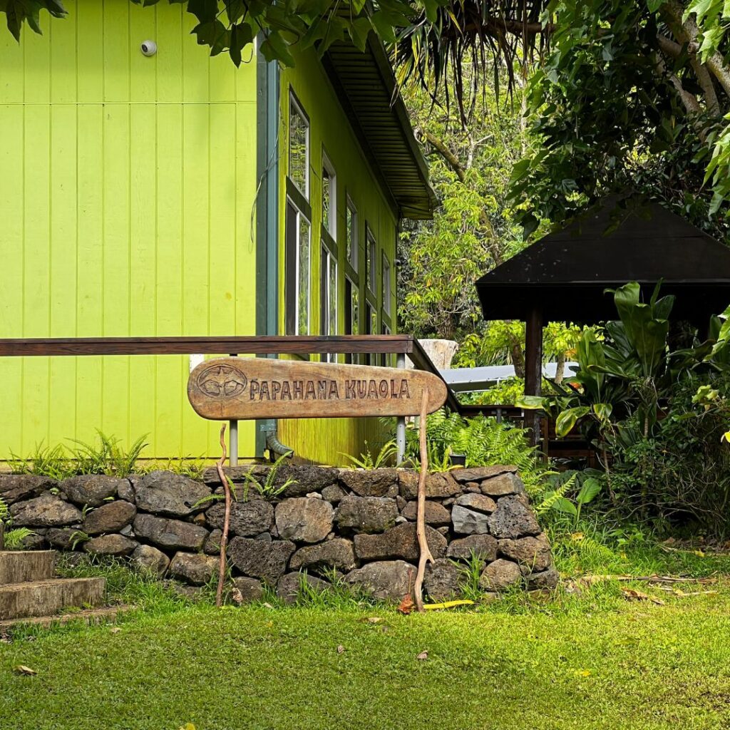 Why Volunteering at Papahana Kuaola Should Be on Your Bucket List Hawaii Calling View of the Papahana Kuaola sign at the main building near the meeting site.
