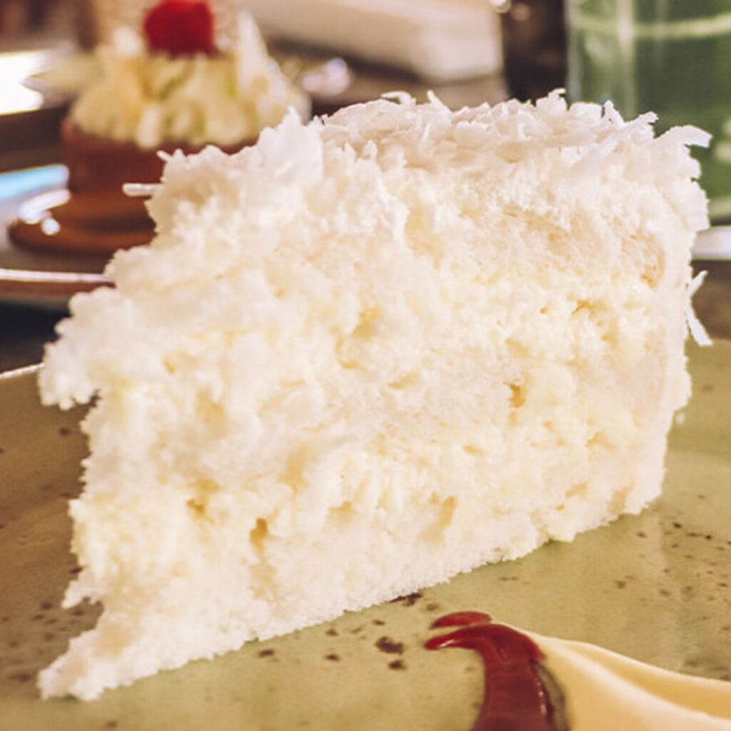 The 23 Best Things To Do In Waikiki |A Local Guide (2025) Hawaii Calling a slice of cake on a plate