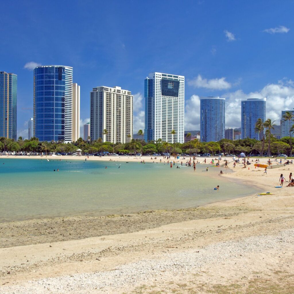 The 23 Best Things To Do In Waikiki |A Local Guide (2025) Hawaii Calling a beach with buildings in the background