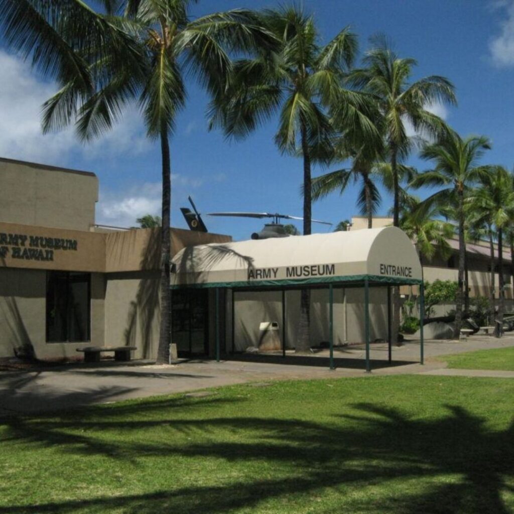 The 23 Best Things To Do In Waikiki |A Local Guide (2025) Hawaii Calling a building with palm trees in front of it