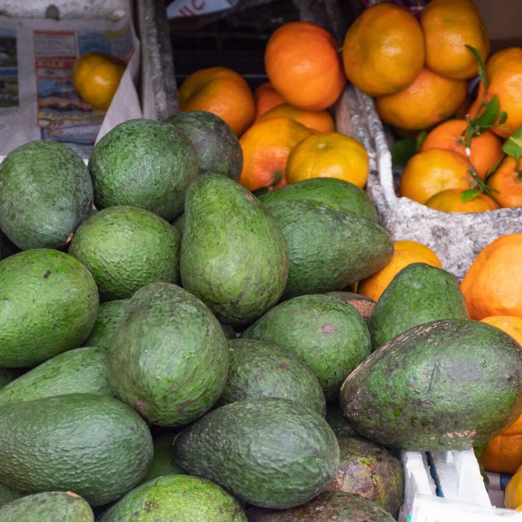 The 49 Best Things To Do In Kona Hawaii Calling a pile of avocados and oranges