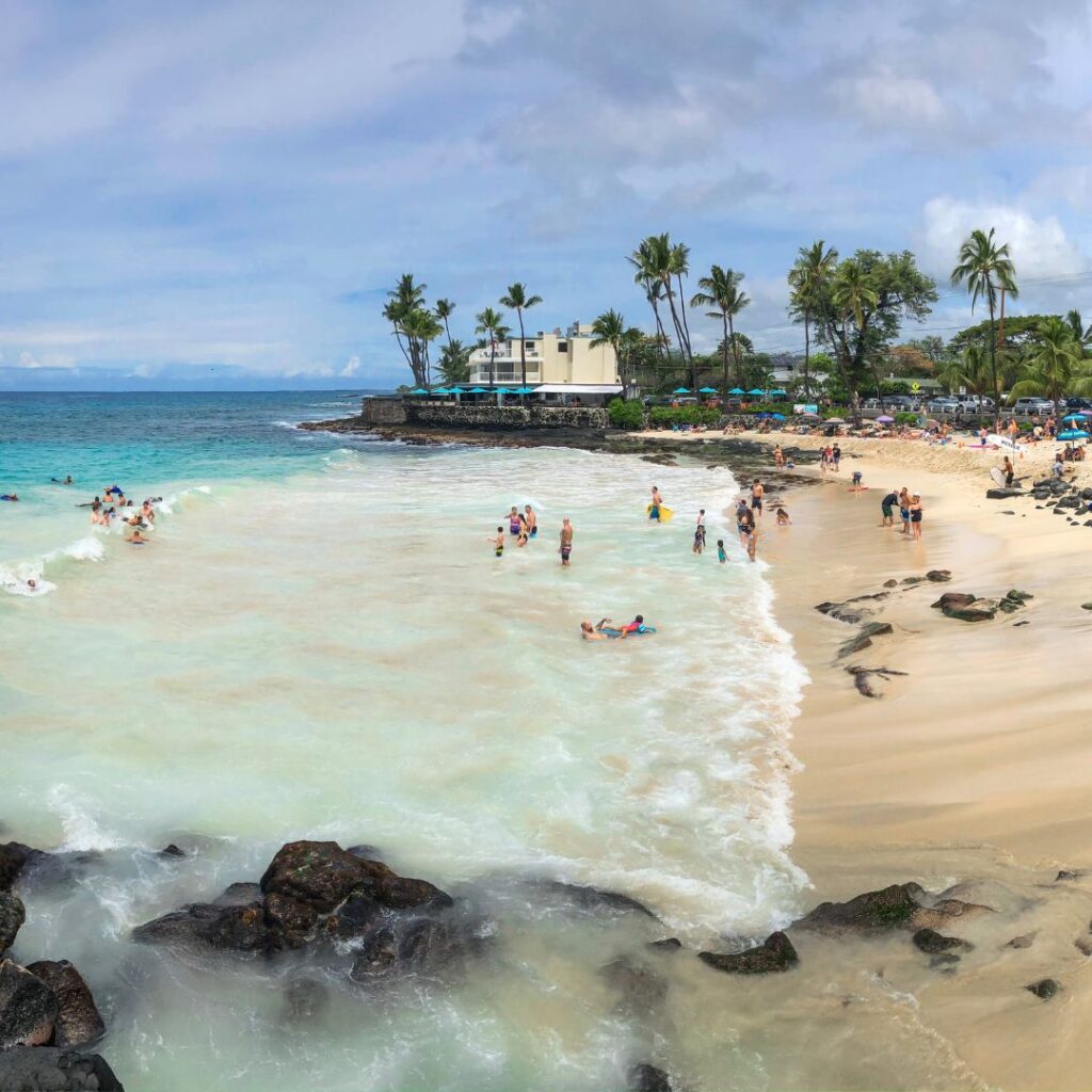 The 49 Best Things To Do In Kona Hawaii Calling a beach with people on the water