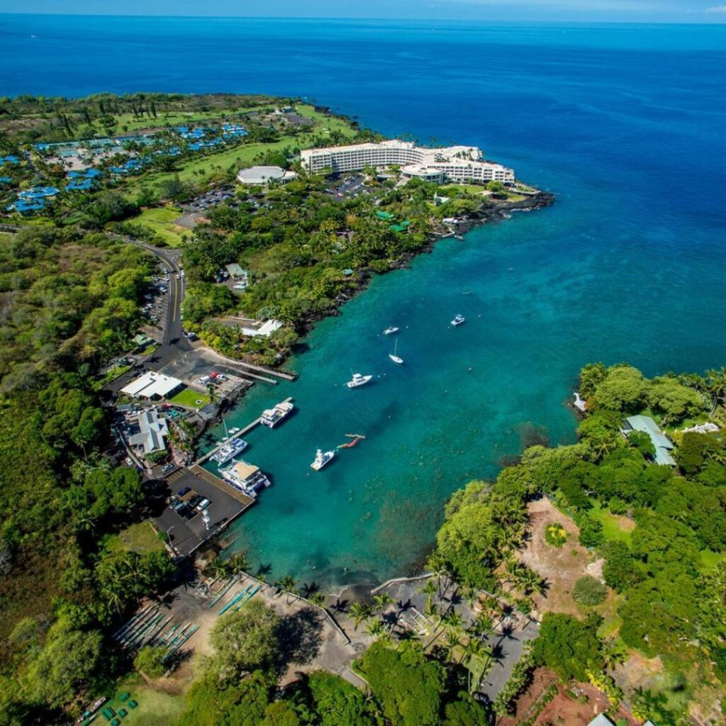The 49 Best Things To Do In Kona Hawaii Calling a body of water with boats and buildings
