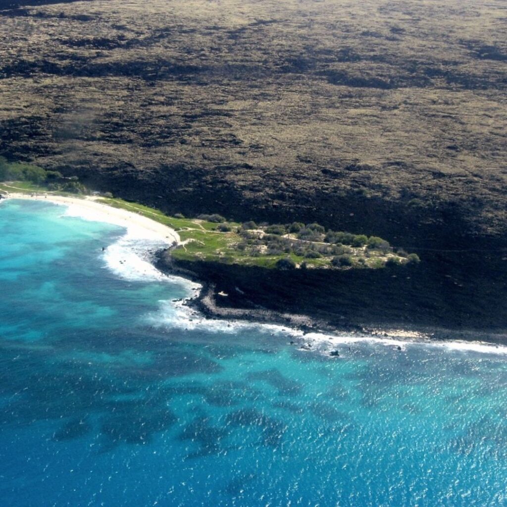 The 49 Best Things To Do In Kona Hawaii Calling an aerial view of a beach