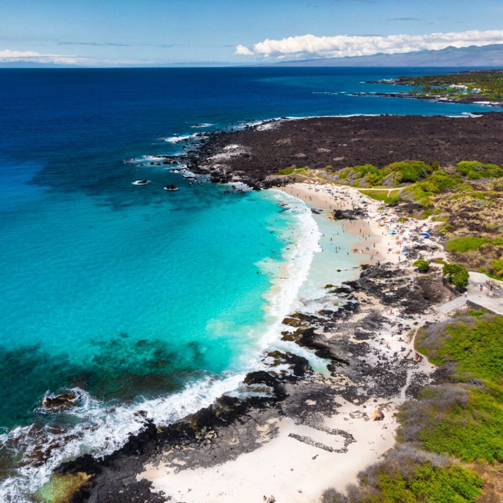 The 49 Best Things To Do In Kona Hawaii Calling a beach with blue water and trees