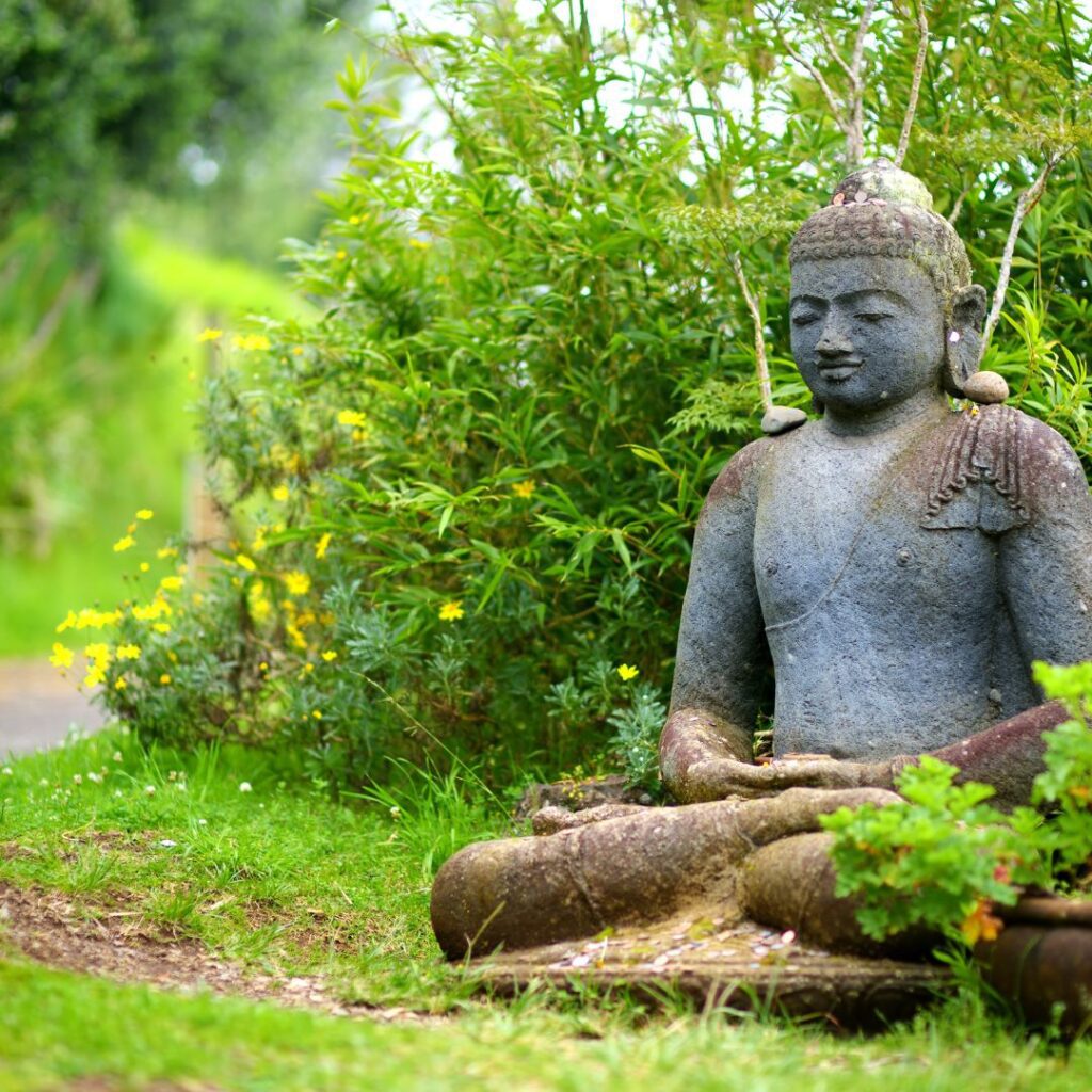 The 26 Best Things To Do On Maui | Bucket List Guide (2025) Hawaii Calling a stone statue of a man sitting in a lotus position