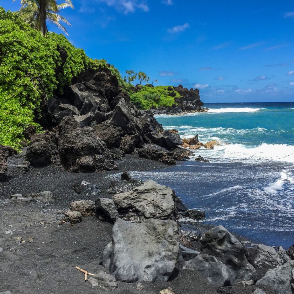 The 26 Best Things To Do On Maui | Bucket List Guide (2025) Hawaii Calling a black sand beach with rocks and water
