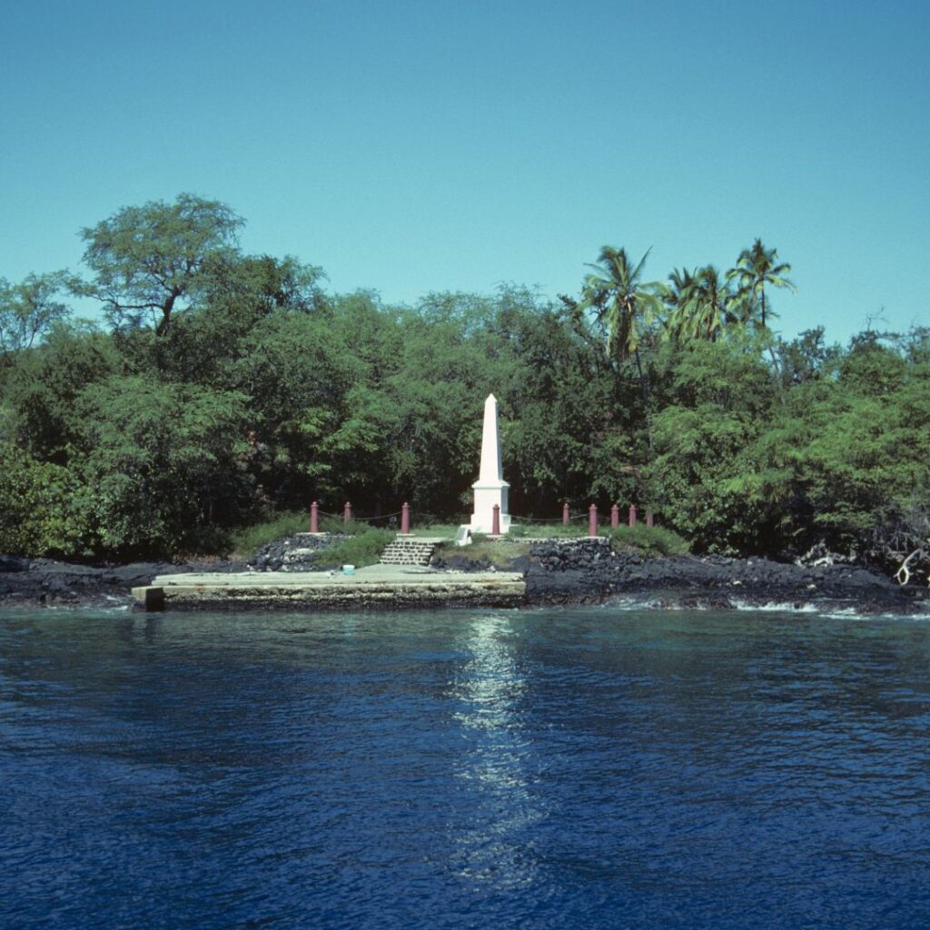 35 Best Things To Do On The Big Island Hawaii Calling a white tower on a rocky island with trees and a body of water
