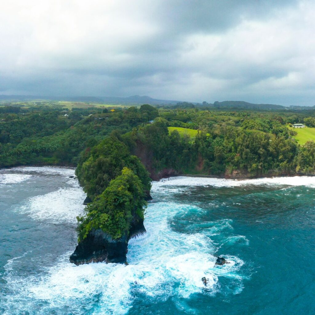 35 Best Things To Do On The Big Island Hawaii Calling a body of water with trees and a beach